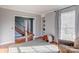 Bright living room with hardwood floors, built-in shelves, and large windows offering plenty of natural light at 1537 Wheaton Nw Way, Concord, NC 28027