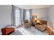 Cozy living area with large windows, plush seating, and inviting natural light at 1537 Wheaton Nw Way, Concord, NC 28027