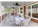 Charming screened porch with ceiling fans and room for seating is perfect for outdoor relaxation at 1537 Wheaton Nw Way, Concord, NC 28027