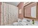 Charming bathroom with stylish shower curtain, modern fixtures, and a large mirror at 1584 Beverly Ln, Lincolnton, NC 28092