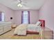 Bright bedroom with ample natural light, complemented by soft purple accents and neutral furnishings at 1584 Beverly Ln, Lincolnton, NC 28092