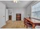 Bedroom featuring neutral walls, a wooden bookshelf and desk with a chair, and an attached closet at 1584 Beverly Ln, Lincolnton, NC 28092