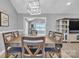 Well-lit dining area showcasing rustic table, decorative lighting, and a view into the living room at 1584 Beverly Ln, Lincolnton, NC 28092