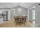 Cozy dining room featuring modern lighting, a decorative sign and stainless steel kitchen appliances in view at 1584 Beverly Ln, Lincolnton, NC 28092