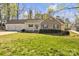 Charming single-story home with a brick facade, attached two-car garage, and well-maintained front yard at 1584 Beverly Ln, Lincolnton, NC 28092