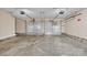 Spacious garage with two parking spaces featuring concrete floors and brick skirting at 1584 Beverly Ln, Lincolnton, NC 28092