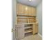 Bright laundry room featuring custom cabinets and shelving for optimal storage space at 1584 Beverly Ln, Lincolnton, NC 28092