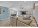 Open-concept living area with access to dining area and featuring a large comfortable sectional at 1584 Beverly Ln, Lincolnton, NC 28092