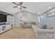 Inviting living room with vaulted ceiling, plush sectional sofa, and neutral color palette at 1584 Beverly Ln, Lincolnton, NC 28092