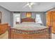 This main bedroom features natural light, a decorative headboard, and a neutral color palette at 1584 Beverly Ln, Lincolnton, NC 28092