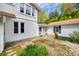 Charming backyard with stone pathway, lush greenery and potential for serene outdoor living at 165 Mimosa Ter, Wadesboro, NC 28170