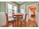 Charming breakfast nook with a round table, decorative chairs, and natural lighting from nearby windows at 165 Mimosa Ter, Wadesboro, NC 28170