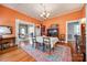 Inviting dining room with hardwood floors, chandelier lighting, an area rug, and an open design to a living area at 165 Mimosa Ter, Wadesboro, NC 28170