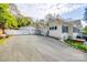 Well-maintained white home with a two-car garage and spacious driveway providing ample parking at 165 Mimosa Ter, Wadesboro, NC 28170