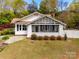 Charming craftsman-style home with a screened-in porch and mature landscaping at 165 Mimosa Ter, Wadesboro, NC 28170