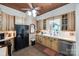 Rustic kitchen featuring wooden cabinets, stainless steel appliances, and unique tile accents at 165 Mimosa Ter, Wadesboro, NC 28170