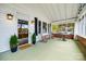 Inviting screened porch with comfortable seating and charming decor at 165 Mimosa Ter, Wadesboro, NC 28170