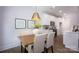 Cozy dining space with modern chandelier, stylish decor, and eat-in kitchen at 19751 Feriba Pl, Cornelius, NC 28031