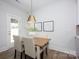 Elegant dining area with views of the backyard and modern pendant lighting at 19751 Feriba Pl, Cornelius, NC 28031