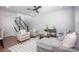 Stylish living room featuring a staircase, modern decor, and hardwood floors at 19751 Feriba Pl, Cornelius, NC 28031