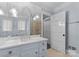 Bright and airy bathroom with marble countertops and elegant fixtures at 2015 Pellyn Wood Dr, Charlotte, NC 28226