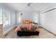Bright bedroom with two large windows, hardwood floors, and a spacious closet at 2015 Pellyn Wood Dr, Charlotte, NC 28226
