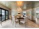 Charming dining room featuring a chandelier, textured wallpaper, and seating for six at 2015 Pellyn Wood Dr, Charlotte, NC 28226