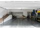 Spacious garage with storage cabinets and room for multiple vehicles at 2015 Pellyn Wood Dr, Charlotte, NC 28226