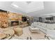 Spacious living room featuring a stone fireplace, modern furniture, and open layout at 2015 Pellyn Wood Dr, Charlotte, NC 28226