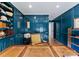 Sophisticated blue office space with custom built-ins and a classic desk at 2015 Pellyn Wood Dr, Charlotte, NC 28226