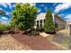 Landscaped backyard showcasing a well-maintained lawn, garden beds, and stone pathway at 2035 Palace Way, Indian Land, SC 29707