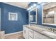 Well-lit bathroom featuring double sinks, granite countertops, and framed mirrors at 2035 Palace Way, Indian Land, SC 29707