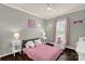 Charming bedroom with pink accents, plush bedding, and lots of natural light at 2035 Palace Way, Indian Land, SC 29707