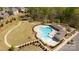 Aerial view of the neighborhood community pool, clubhouse, playground, green space, and parking area at 2035 Palace Way, Indian Land, SC 29707