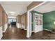 Inviting home hallway featuring hardwood flooring, crown molding, and decorative accents at 2035 Palace Way, Indian Land, SC 29707