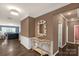 Inviting home hallway featuring hardwood flooring, crown molding, and decorative accents at 2035 Palace Way, Indian Land, SC 29707