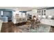 Bright kitchen features white cabinetry, stainless steel appliances, and island seating at 2035 Palace Way, Indian Land, SC 29707