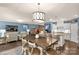 Open-concept kitchen and living room with island seating and stylish decor at 2035 Palace Way, Indian Land, SC 29707