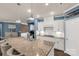 Contemporary kitchen showcasing granite countertops, stainless steel appliances, and sleek white cabinets at 2035 Palace Way, Indian Land, SC 29707