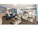 Open floor plan featuring living room flowing into modern white kitchen at 2035 Palace Way, Indian Land, SC 29707