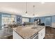 Bright and airy open-concept living space connecting the kitchen, dining area, and living room at 2035 Palace Way, Indian Land, SC 29707