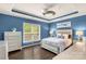 Serene main bedroom showcasing tray ceilings and stylish decor at 2035 Palace Way, Indian Land, SC 29707
