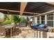 Inviting outdoor patio with comfortable seating, dining area, and pergola at 2035 Palace Way, Indian Land, SC 29707