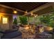 Outdoor patio with lounge seating, a dining table, and professionally landscaped gardens at 2035 Palace Way, Indian Land, SC 29707