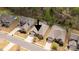 Aerial view of a single-story home surrounded by mature trees and neighboring houses in a suburban neighborhood at 2035 Palace Way, Indian Land, SC 29707