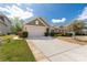 Charming single-story home featuring a two-car garage, manicured lawn, and well-maintained landscaping at 2035 Palace Way, Indian Land, SC 29707