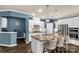 Modern kitchen with white cabinets, granite countertops, stainless steel appliances, and island seating at 2035 Palace Way, Indian Land, SC 29707