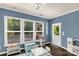 Charming playroom with blue walls, hardwood floors, and various ' toys and play furniture at 2035 Palace Way, Indian Land, SC 29707