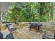 Spacious back deck featuring a grill and outdoor seating overlooking the backyard at 2117 Camp Greene St, Charlotte, NC 28208