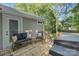 Comfortable back deck with outdoor seating and a grill, perfect for entertaining at 2117 Camp Greene St, Charlotte, NC 28208